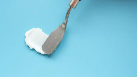 Smear of moisturizer moisturizing cream on blue background close-up, top view. Stock Footage 237591965