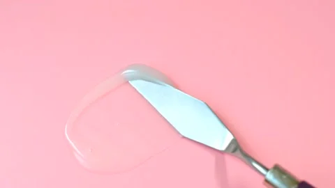 Smear of moisturizer on pink background close-up. Stock Footage 221886127