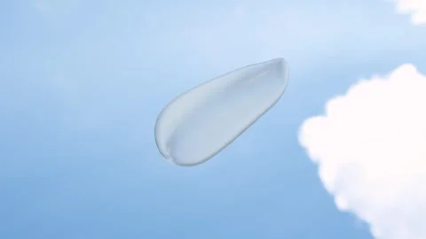 Smear of moisturizing cream against background of sky and clouds. Stock Footage 340545008
