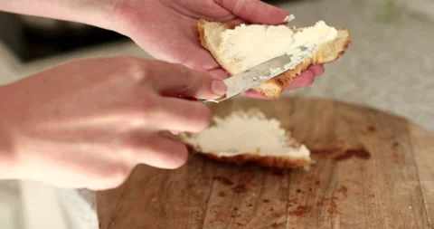 Smear organic butter on bread. Stock Footage 242493705