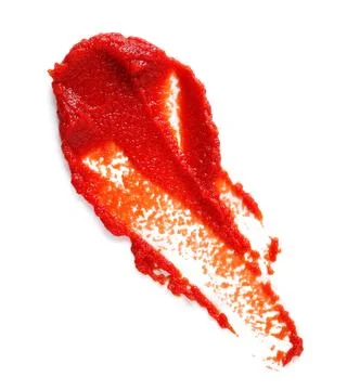 Smear of red tomato paste on white background Stock Photos