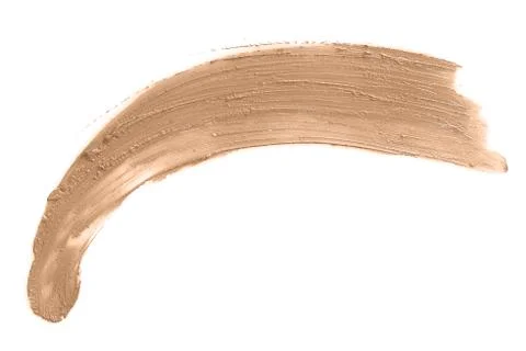 Smeared face make-up solid creme foundation sample on a white background Stock Photos