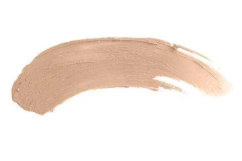 Smeared face make-up solid creme foundation sample on a white background Stock Photos