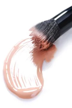 Smeared Liquid Beige Make Up Foundation on White Background Stock Photos