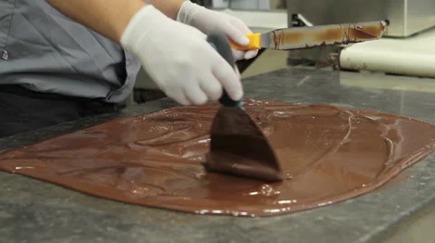 Smearing melted chocolate on table Stock Footage 24238032