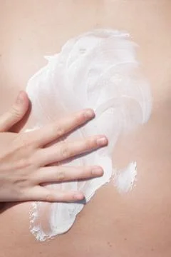 Smearing sunscreen Stock Photos