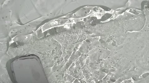 Smearing transparent gel on a white surface Stock Footage 252195569