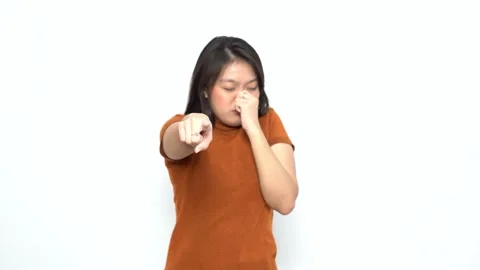 Smelling something stinky and disgusting of Beautiful Asian Woman Stock Footage 166604051