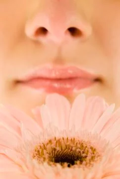 Smelling a spring flower Stock-Fotos