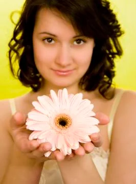 Smelling a spring flower Stock Photos