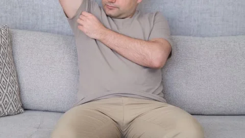 Smelly man on sofa Stock Footage 265791331