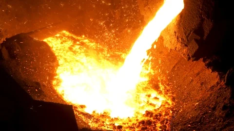 Smelting of the metal in the foundry at the steel mill. Stock footage. Close up Stock Footage