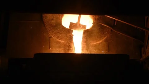 Smelting metal. Liquid metal is drained from the furnace Stock Footage