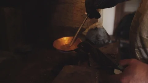 Smelting of tin in the article of copper. Stock Footage 94937640