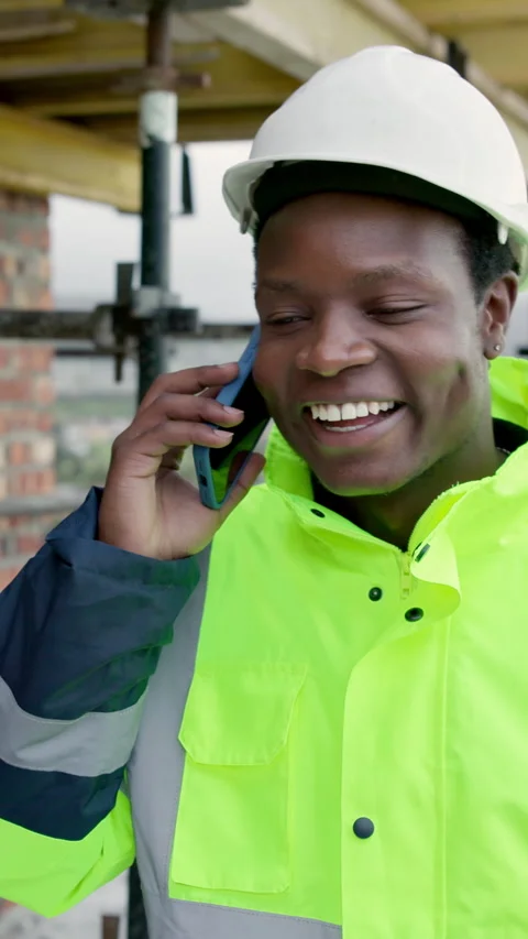 Smile, black man and engineer at site with phone call, inspection and planning Stock Footage 338009736