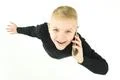 The smile boy phone on the white background. View from above Photo