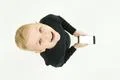 The smile boy stand with a smartphone. View from above Photo