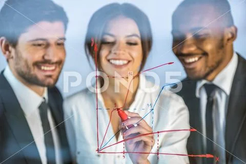 The smile business people draw the graph at the virtual screen Stock Photos