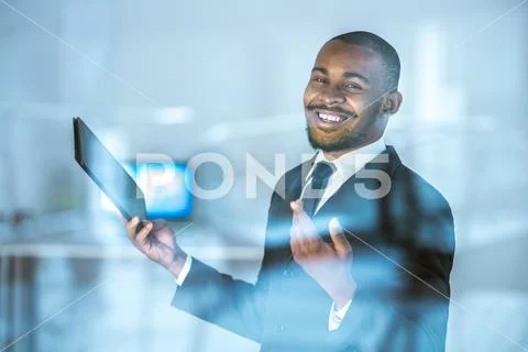 The smile businessman gesture with a tablet over the window Stock Photos