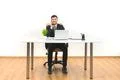The smile businessman phones at the desktop on the white wall background Photo