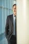 The smile businessman stand over the column Photo