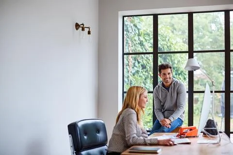 Smile, computer and creative team in office for conversation, project manag.. Stock Photos