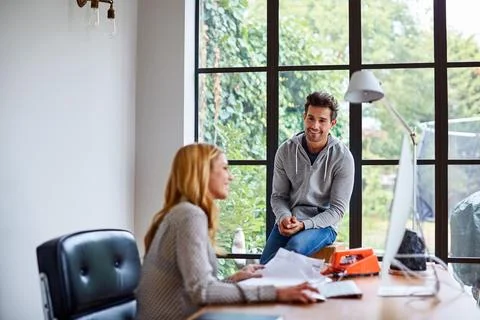Smile, computer and creative team in office for project management, discussion Stock Photos