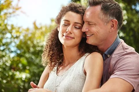 Smile, couple and hug for commitment to marriage, relationship and happiness on 库存照片
