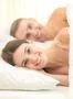 The smile couple lie on the bed Photo