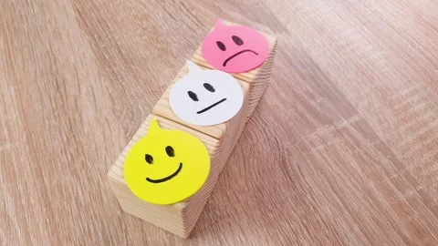 Smile on cubes joy, fun, sadness, neutral, on bright paper. Stock Footage 317326506