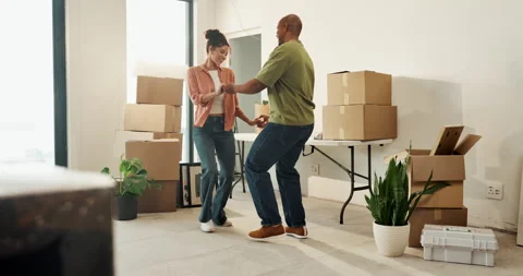 Smile, dancing or couple holding hands in new home, relocation or property Stockbeeldmateriaal 336793428