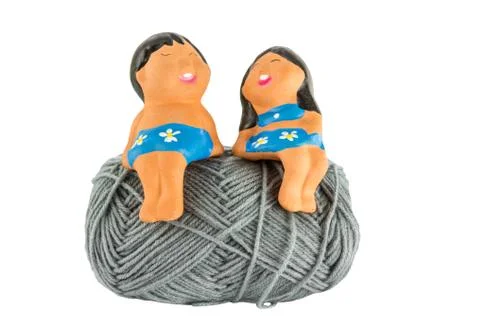 Smile doll on ball yarn Stock-Fotos