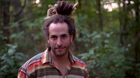 Smile with dreads in bun Stock Footage 171734613