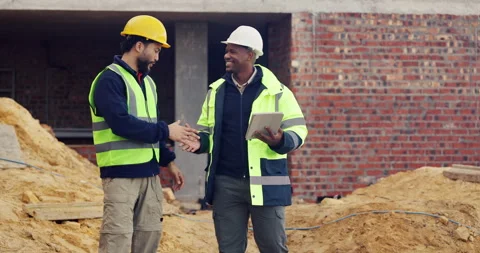 Smile, engineer and tablet at construction site with handshake, welcome and Stock Footage 336807369