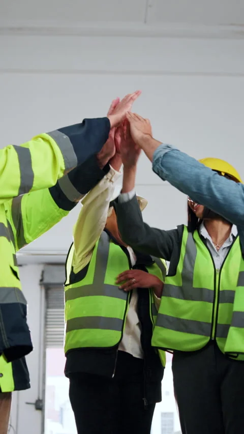 Smile, engineer and team with high five for construction, agreement and victory Stock Footage 342326196