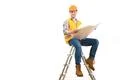 The smile engineer with a paper sitting on the ladder on the white background Photo
