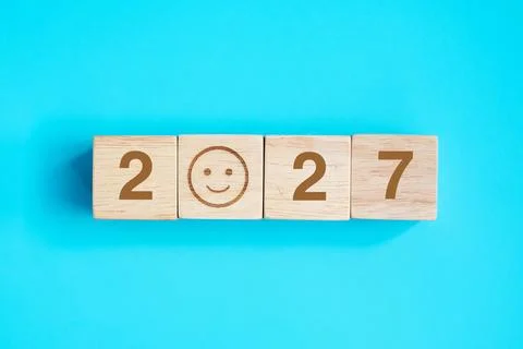 Smile face block with 2027 text on blue background. Satisfaction, feedback,.. Stock Photos
