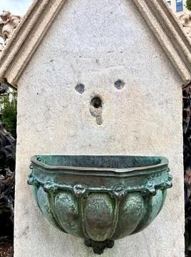 Smile face pattern on the side of a water fountain Stock Photos
