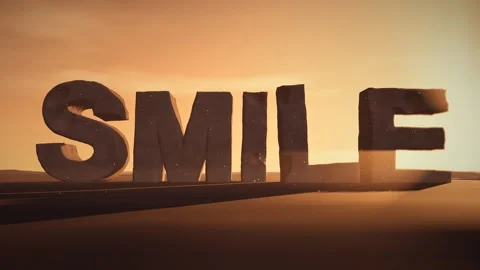 Smile Giant Eroded Stone Letters Standing in a Desert at Sunset with Volumetric Stock Footage 342221822