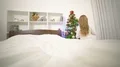 The smile girl lay on the bed and smile near the christmas tree 4k or 4k+ Resolution