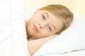 The smile girl lay on the bed Photo