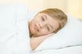 The smile girl lie on the bed Photo