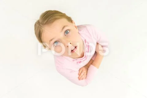 The smile girl look to the camera. View from above Stock Photos
