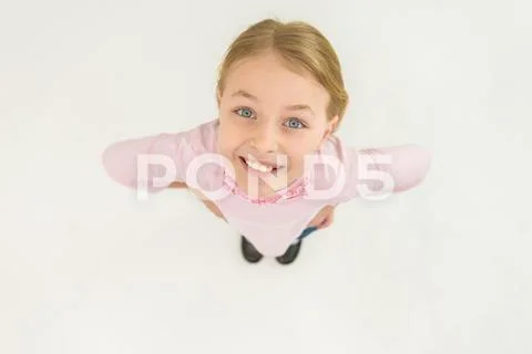 The smile girl stand and look to the camera. View from above Stock Photos