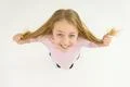 The smile girl touch her hair. View from above Photo
