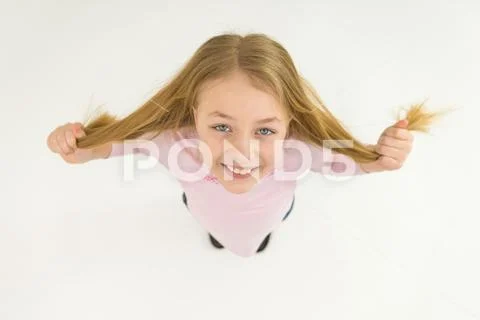 The smile girl touch her hair. View from above Stock Photos