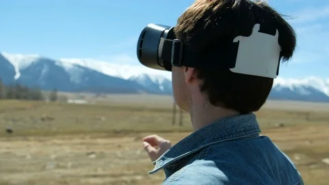Smile happy man getting experience using VR-headset glasses of virtual reality Stock Footage 75791221