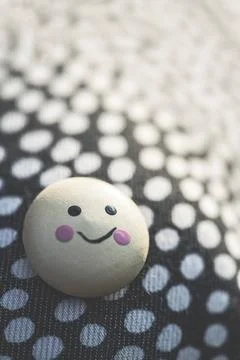 Smile icon on textile surface with points. Smile icon on textile surface w... Stock Photos