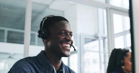 Smile, man and computer with headset at call centre for customer service, client Fotos de archivo
