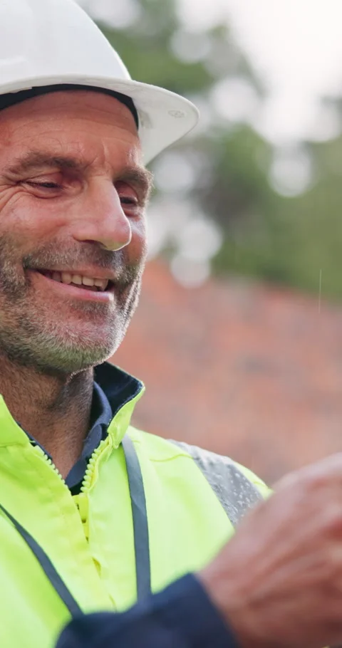 Smile, man and construction worker on site for feedback on maintenance, building Stock Footage 340951602